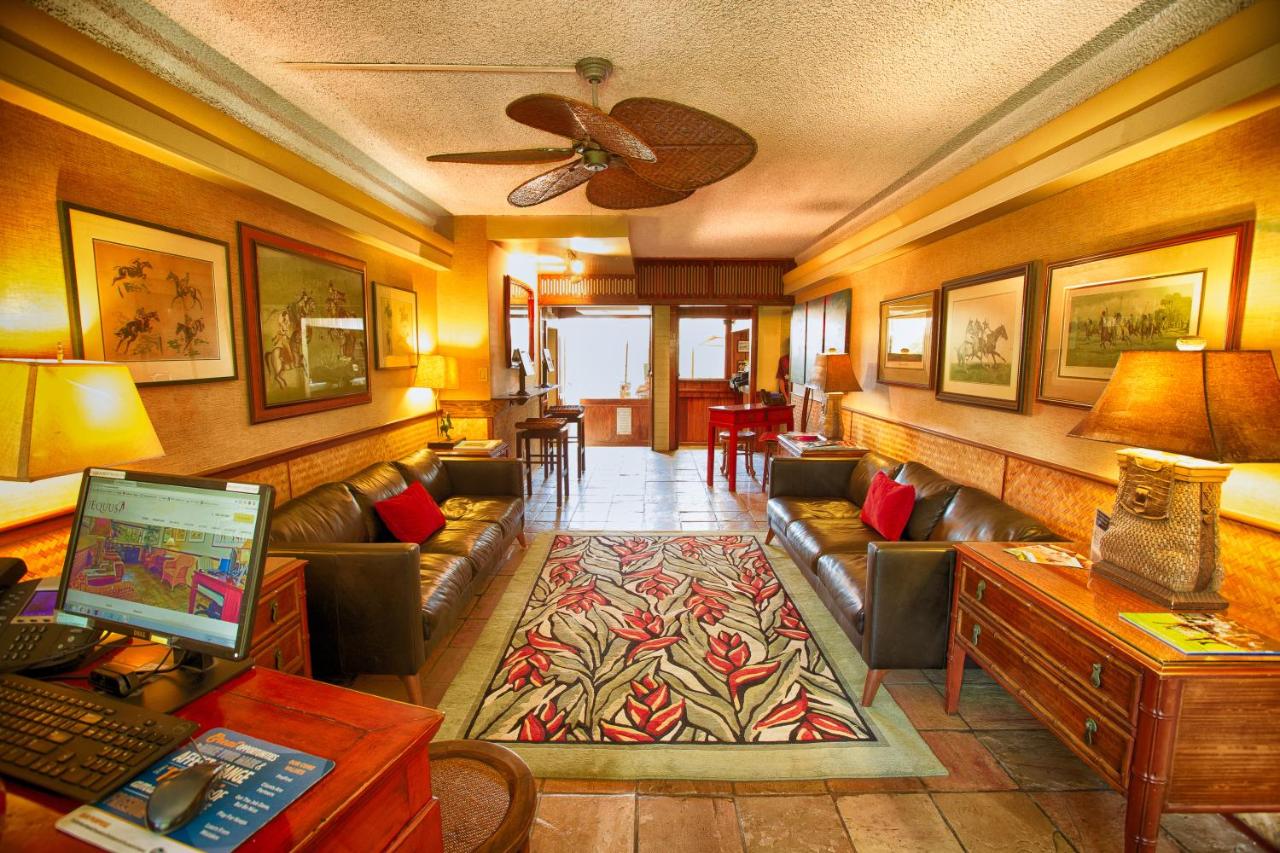 The Equus lobby in warm lighting and carpet surrounded by chairs