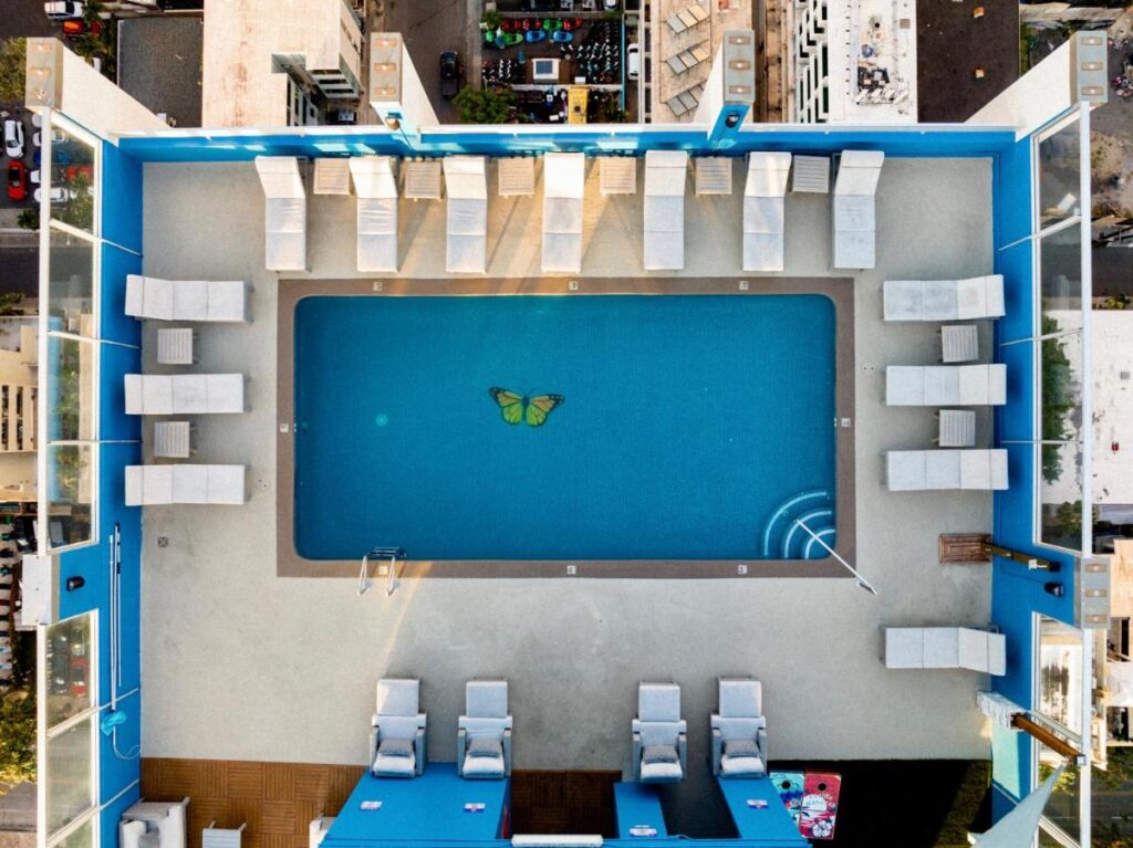 Bird's eye view of Pacific Monarch rooftop pool where a butterfly seen on the bottom