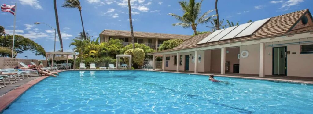 a close shot of Kihei Kai Nani pool with it's buildings in the background
