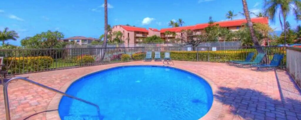 A view of Maui Vista circular pool with the building in the background