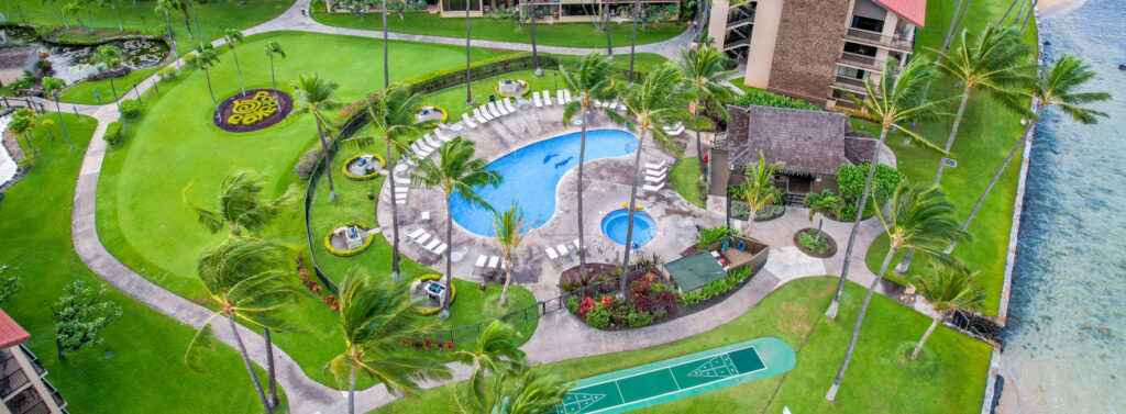 Aerial shot of Papakea Resort and it's pool next to the Maui's Kaanapali coast