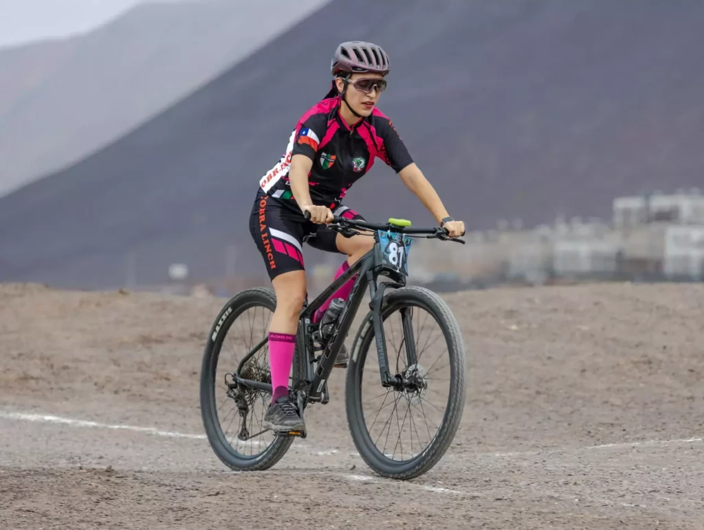 Photo of a Woman Mountain Bike Racing