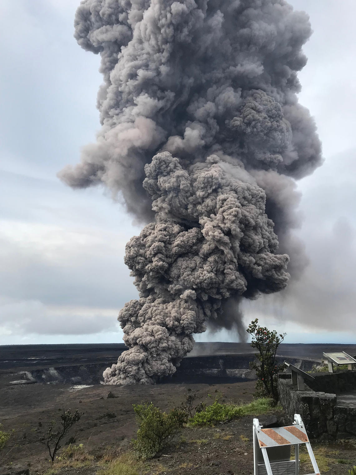 The Lava's gray strong smoke clouds coming outside of a Hawaiian Crater