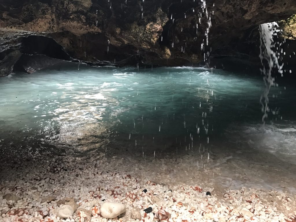 Mermaid Cove in Oahu, Hawaii, boasts a secluded area as water trickles down into a body of water and sand 