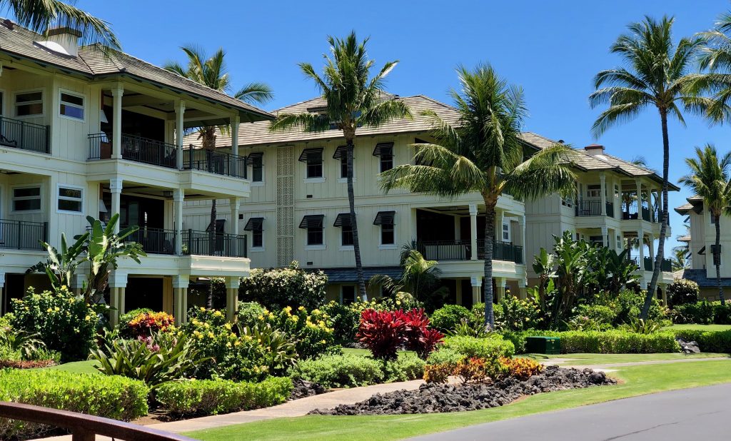 Kolea at Waikōloa Beach Resort, a vacation home rentals in Puako, Hawaii. It's showcasing palm trees and condos or private home rentals.