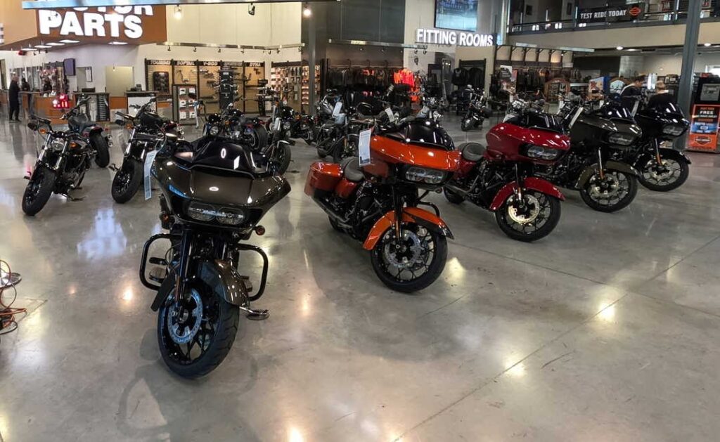 A collection of motorcycles that varied in black to red colors that are showcased within a mall in Las Vegas