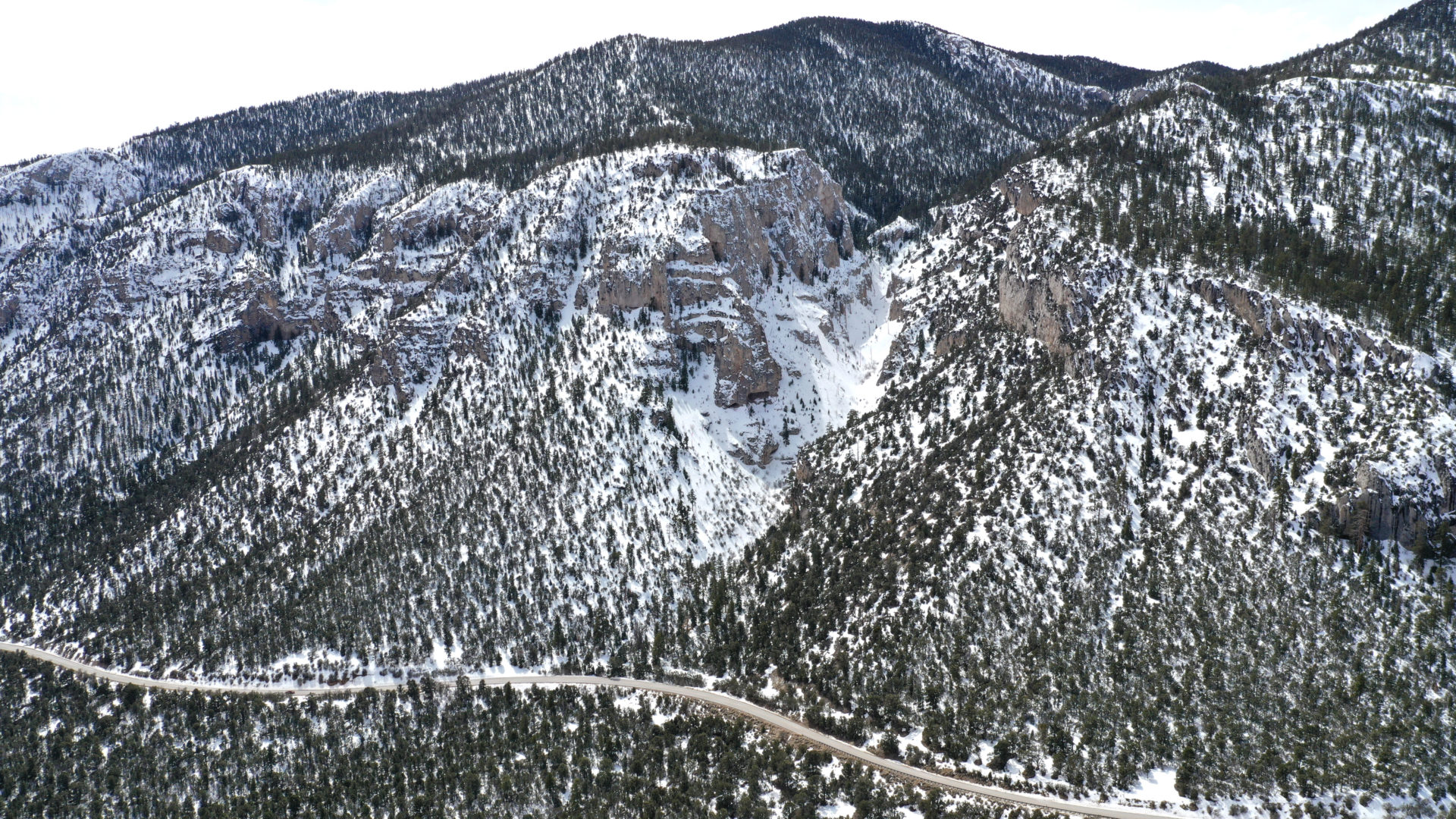 Mt. Charleston presents a alpine landscape with snow dense pine forests, rugged mountain peaks, and pristine snow-capped slopes located in the desert of Las Vegas