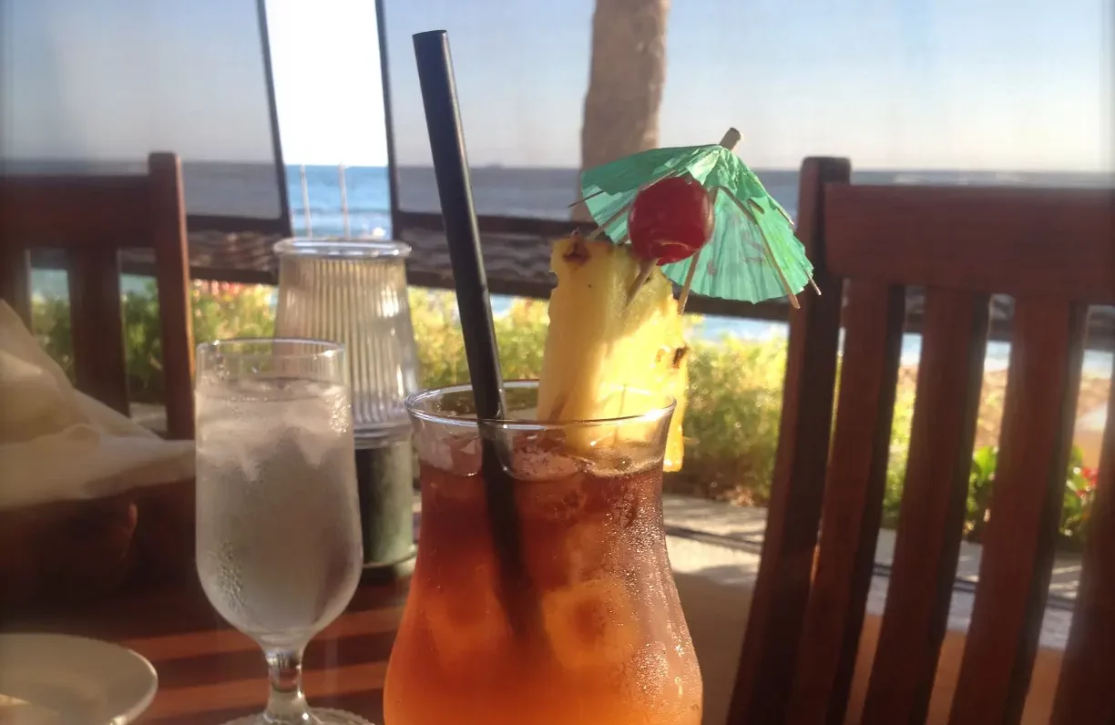 Known for its lively tropical music and live local entertainment, the signature cocktail at The Royal Hawaiian's Mai Tai Bar is a must-try. 