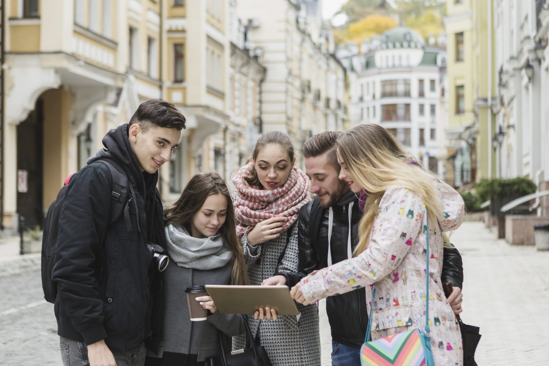 cheerful-tourists-with-tablet-street divi-cart-pro-about-2