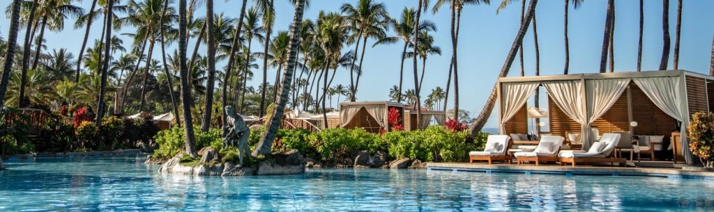 Grand Wailea Resort Hotel & Spa poolside where you can see tropical trees nearby