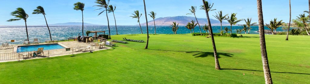 Kihei Surfside open nature area with a pool and beach view