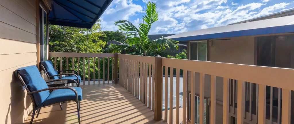 Maui Oceanfront Inn balcony view with blue chairs