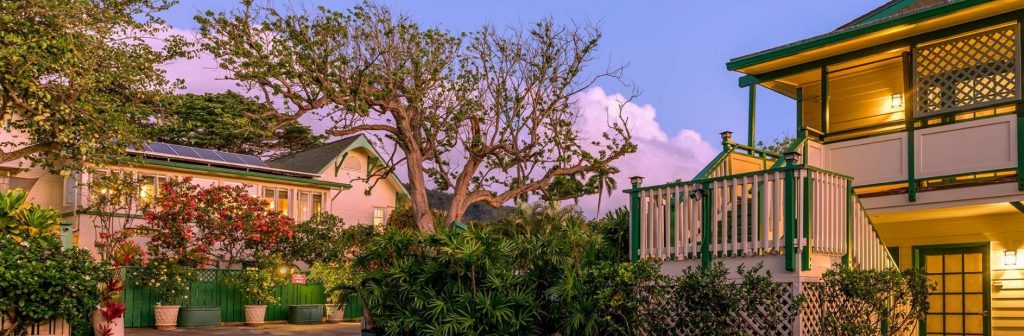 The Historic Wailuku Inn during a pink sunset