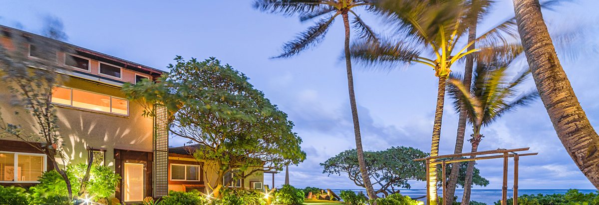 The view of Tiki Moon Villas lit up during afternoon hours