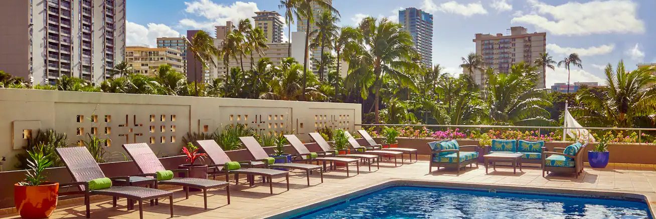 Double Tree Alana Hotel poolside with the chairs lined up on the side