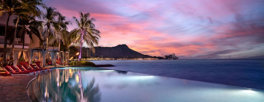 Sheraton Waikiki pool side against the Waikiki beach ocean with Diamond Head shown in the background