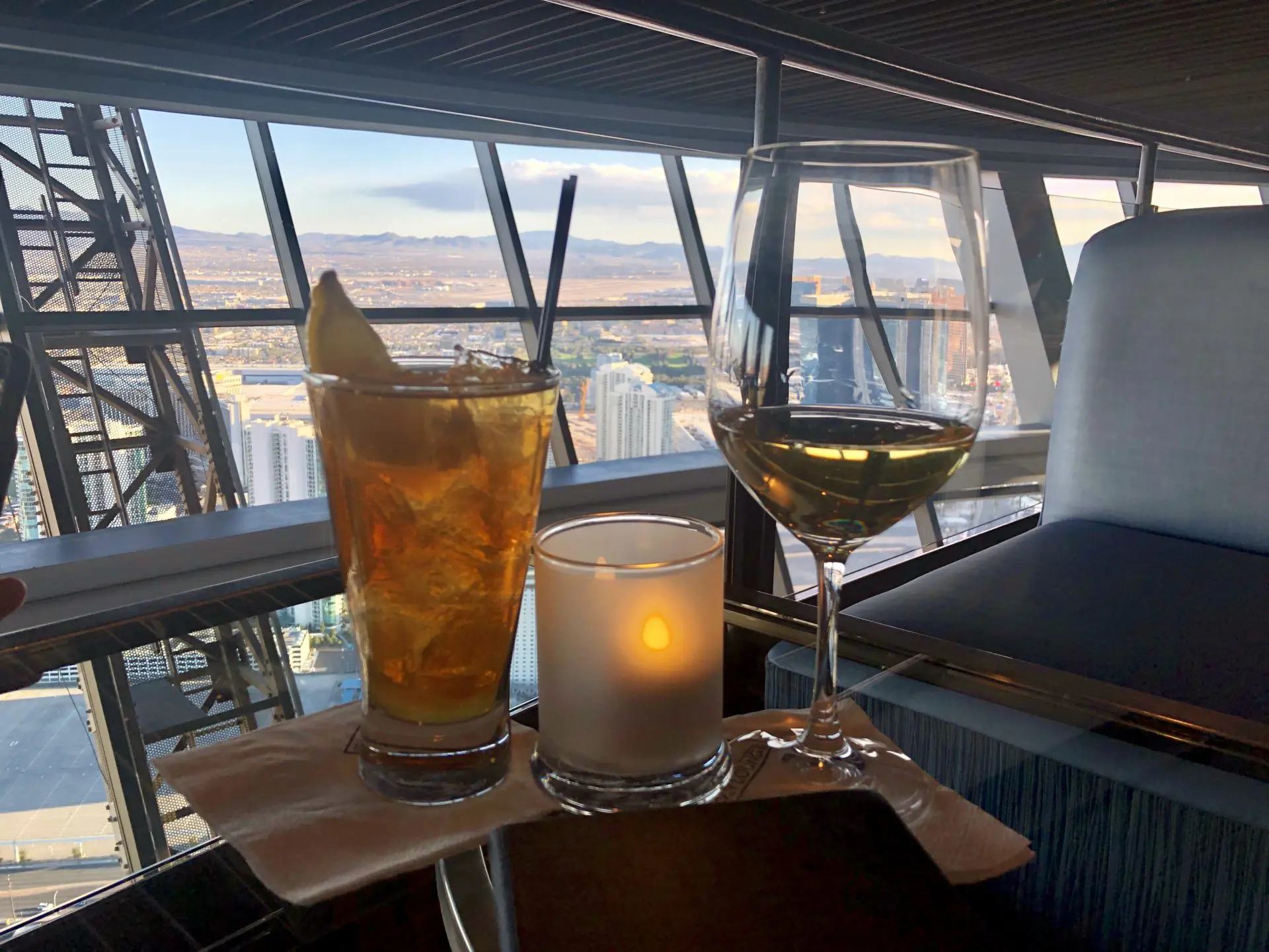 Sleek lounge offering creative cocktails, light bites & floor-to-ceiling windows with Strip views.