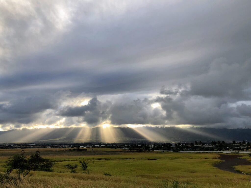 Sunlight filtering through storm clouds over Kahului